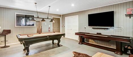 Pool table & Shuffle board in the detached game room. 