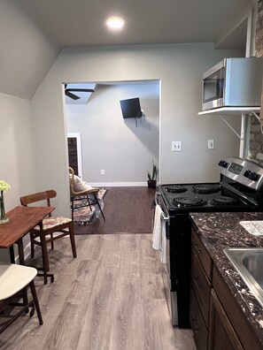 Fully equipped with fridge, stove, microwave, and dishwasher. 