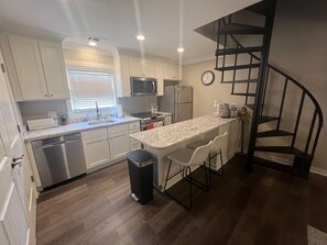 Modern Full Kitchen. Spiral Stairs to Upstair Bedroom.