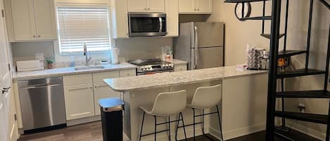 New Modern Full Kitchen. Spiral Stairs to Upstairs Bedroom