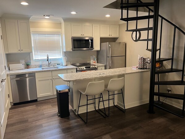 New Modern Full Kitchen. Spiral Stairs to Upstairs Bedroom