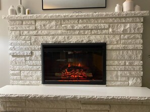 Enjoy the warm glow of our newly installed electric fireplace