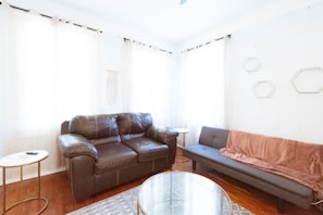 One of three living rooms, this one features a sleeper sofa