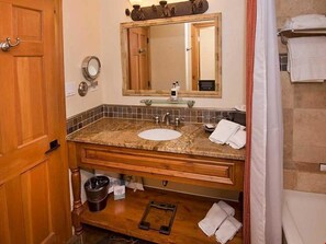 Get ready for the day ahead in the large and bright bathroom.