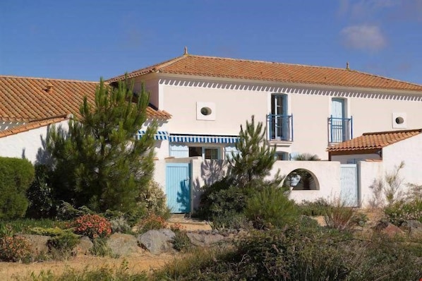 Feel right at home in these classic French houses - featuring white walls and orange roofs.