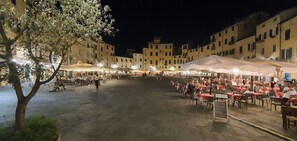 Building, Tent, Plant, Leisure, Tree, City, Urban Area, Mixed-Use, Road Surface, Human Settlement