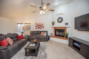 Cozy tv room to relax, watch a movie, and enjoy a warm fire!