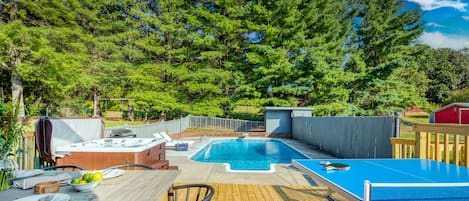 Backyard features a pool, hot tub, BBQ/grill, outdoor dining table, and ping-pong table.