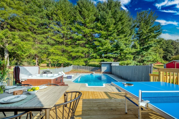 Backyard features a pool, hot tub, BBQ/grill, outdoor dining table, and ping-pong table.