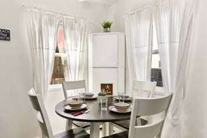 The dining area has a small storgae bin just past the table so you can store your dry food items!