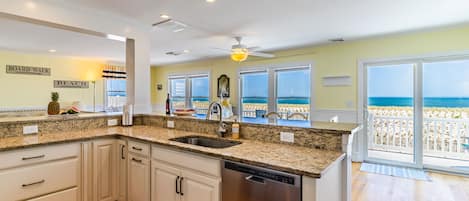 Modern kitchen with all necessities. Open concept with ocean views!