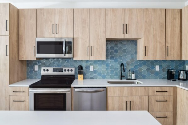 Large countertops and elegant cabinetry make cooking a joy