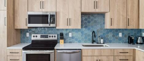 Large countertops and elegant cabinetry make cooking a joy