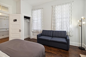 Zen Room is a first floor bedroom with a queen bed, sleeper sofa, and smart TV.
