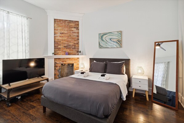 Zen Room is a first floor bedroom with a queen bed, sleeper sofa, and smart TV.