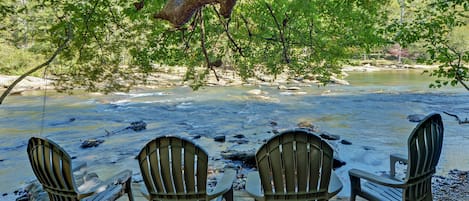 Dock on river, watch the kayakers and tubers go by