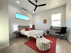 Guest bedroom with views of the desert and mountains 