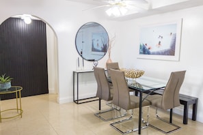 Dining table, chairs, and bench. It's an inviting space for residents to dine.