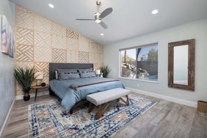 Master Bedroom with King Sized Bed overlooking pool waterfalls.