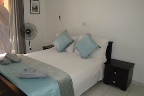 Comfortable double bedroom with fly screens and Air conditioning.