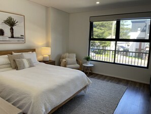 Enjoy a Queen bedroom with sitting area and TV for your comfort and privacy!