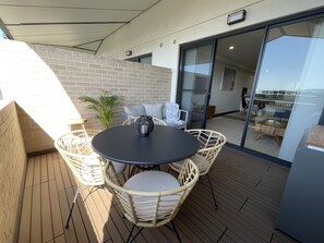 Private sunny deck with amazing ocean views, comfy lounge, BBQ & table & chairs