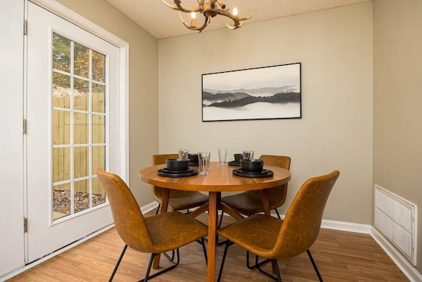 Small dining room next to the kitchen is perfect for a meal, board game or some remote work