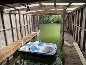 View of boat house interior.  Paddle boat was lost and replaced with 4 kayaks.