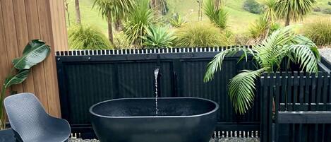 NEW outdoor Stone bath with waterfall tap. Perfect for relaxing and stargazing