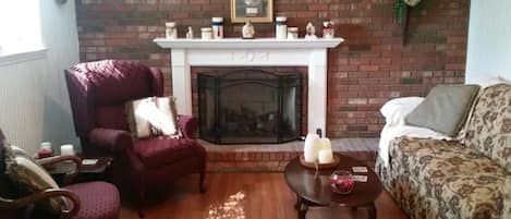 Bright sunny living room with gas fireplace for those chilly nights!