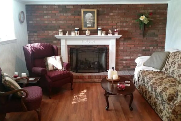 Bright sunny living room with gas fireplace for those chilly nights!