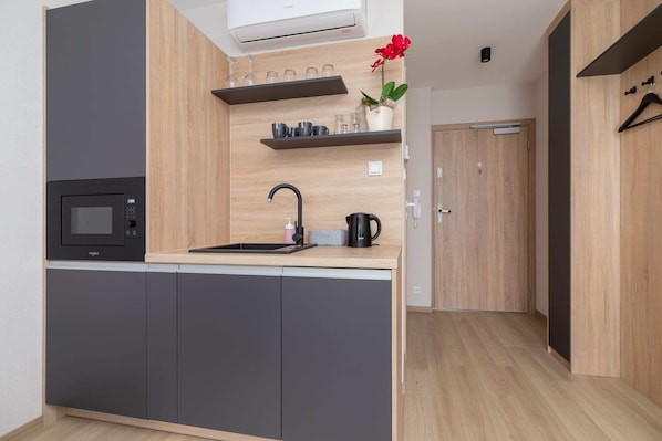 A closer look at the kitchen space, emphasizing the modern appliances and layout.
