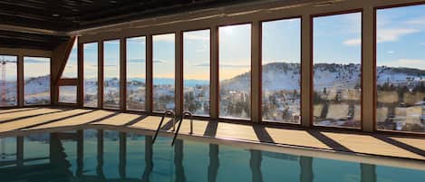 Enjoy a swim in the enormous indoor pool overlooking stunning mountain views (real water photos coming soon!)