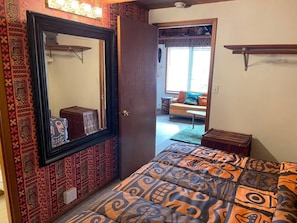 Downstairs/Master bedroom with a vintage tiki theme