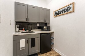 Kitchenette with portable stove with two burners and minifridge
