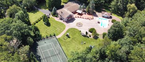 Beautiful 2 acre property with private tennis court, patio and pool!