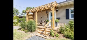 Front entry with porch and arbor 