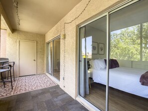 Screened in patio facing the green space. Enjoy your morning coffee here!