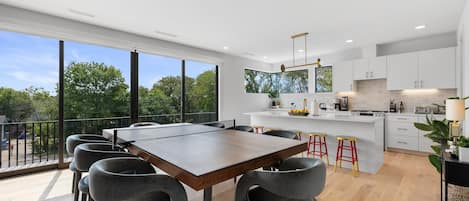 Open concept kitchen and dining area with ample natural lighting