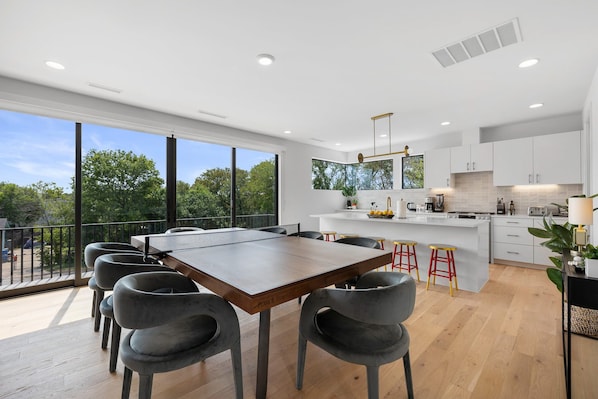 Open concept kitchen and dining area with ample natural lighting