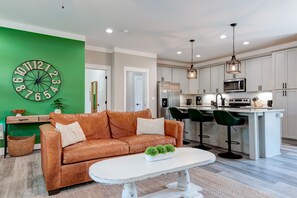 Living room area open to kitchen