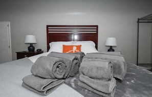 Bedroom 1 - Queen bed, TV, dresser, work station, alarm clock, USB charger fans 