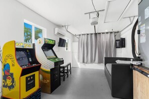 Pixels, pump quarters, and pure fun. This game room is a portal back to the golden age of arcades. ️