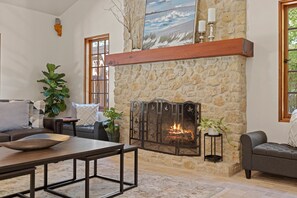 Relax around the full sized wood burning fireplace