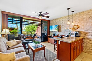 Open concept living room, while staying cool with ceiling fans in the living room