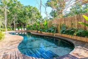 The pool at this condo submerged in nature!