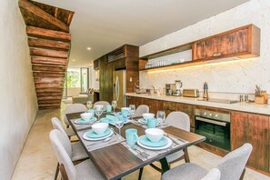 Wonderful table to accommodate 8 and the open kitchen of the condo