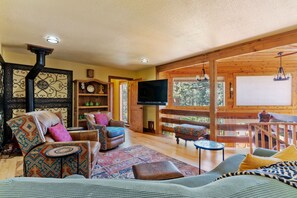 Living Room Overlooking Solarium with Ceiling Fan