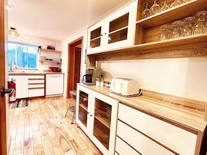 Fully equipped kitchen for cooking meals. 