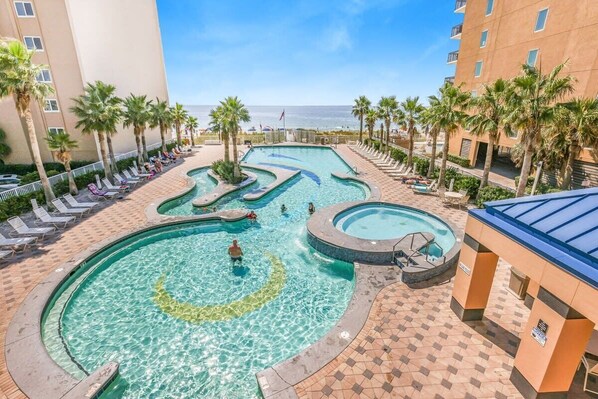 Beach club features sun deck, lounge area, pool, hot tub, lazy river, & restrooms